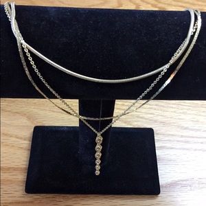 Express multi chain necklace with charm